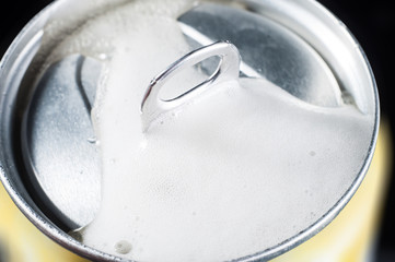 opening of an aluminum beer can close up hissing