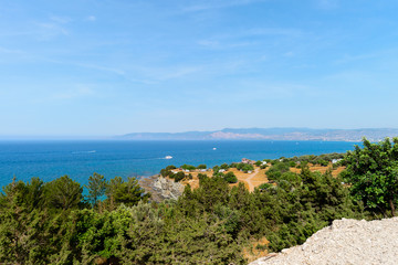 beautiful landscape with mountains overlooking the blue bay of the ocean
