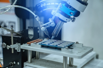 automation machine and detail close up in machine automatic with robotic automation technology for technology production factory