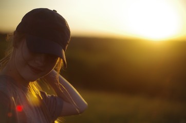  young girl smiling at sunset