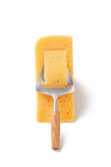 Dutch cheese with typical slicer isolated over white
