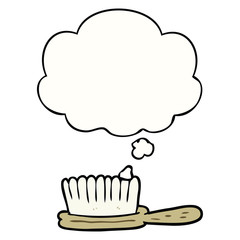 cartoon hairbrush and thought bubble