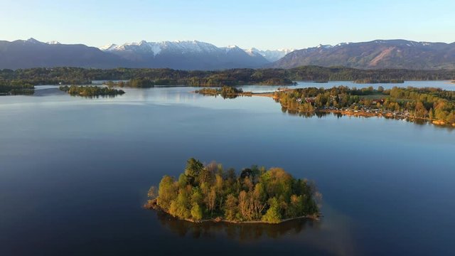 Flight over the island of M&uuml;hlw&ouml;rth in lake Staffelsee in Bavaria, Germany