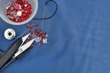 scissors, needle and misangas on the cord