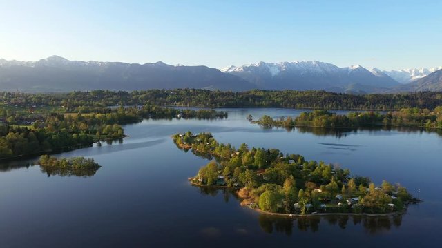 Flight over the campig island of Buchau in lake Staffelsee in Bavaria, Germany