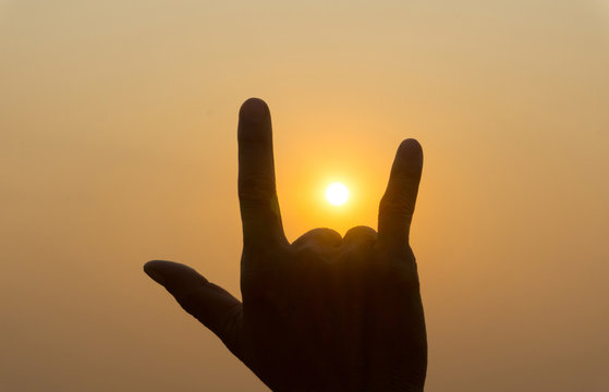 Silhouette hand finger symbol with twilight sunset sky. Hand sign "I Love You",Valentines day,love concept