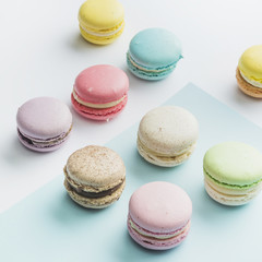 Many colorful macaroons on dual backdrop