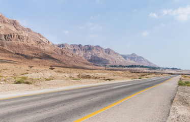 Panoramic  view of the road, coast of Dead Sea and mountains in the Judean Desert in the Dead Sea region in Israel
