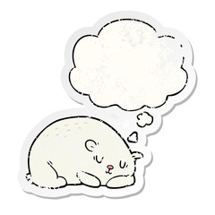 cartoon polar bear and thought bubble as a distressed worn sticker
