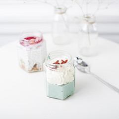 Freshly fruit smoothies in the glass jar on white table