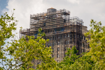Building under construction with scaffolding in New York Manhattan