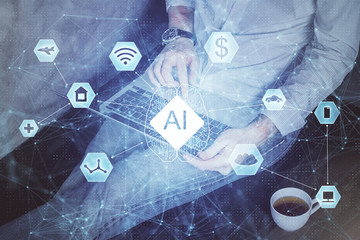 Multi exposure of data internet theme hologram with man working on computer on background. Concept...