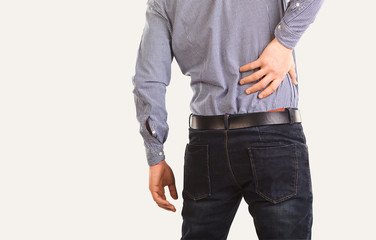The man is holding his sore knee.
