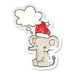 cute christmas elephant and thought bubble as a distressed worn sticker