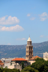 Saint Domnius bell tower, landmark in Split, Croatia, surrounded with trees.