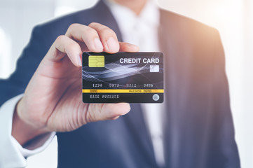 businessman holding credit card mockup . Plastic bank-card design mock up