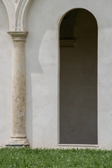 Collegno, Italy, may 2019. Columns and arcades in the ancient Certosa Reale di Collegno
