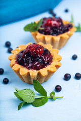Small berry cake and ripe berries