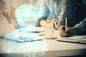 Obraz premium AR hologram with man working on computer on background. Augmented reality concept. Double exposure.