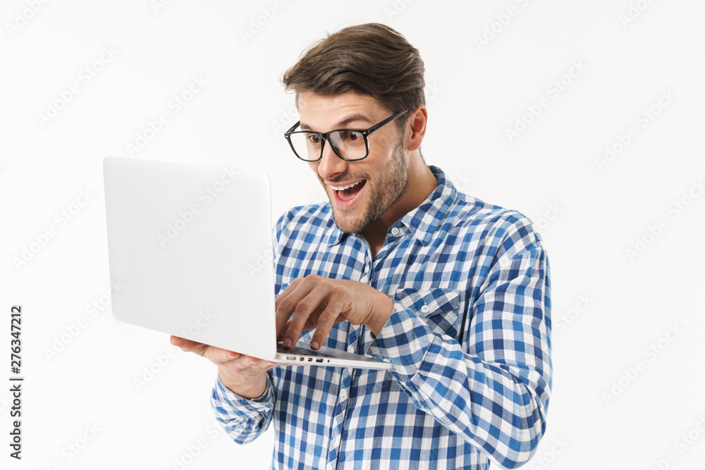 Poster attractive young brunette man wearing plaid shirt