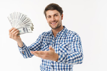 Attractive young brunette man wearing plaid shirt