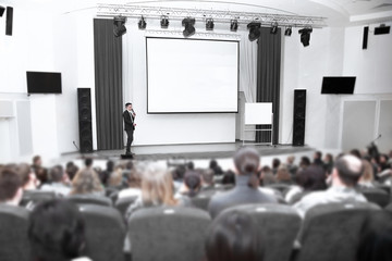 businessman man standing on stage during a press conference