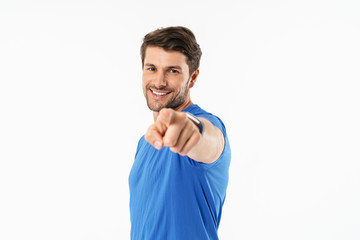 Attractive young fit sportsman wearing t-shirt standing