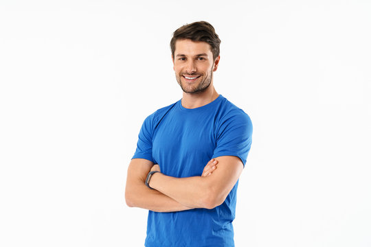 Attractive young fit sportsman wearing t-shirt standing