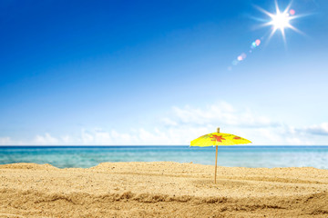 Summer photo of beach and umbrella 