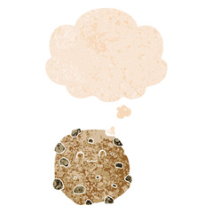 cartoon biscuit and thought bubble in retro textured style