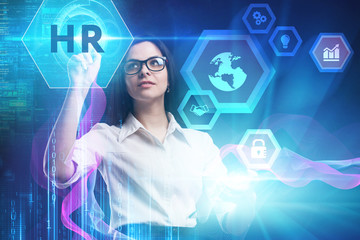The concept of business, technology, the Internet and the network. A young entrepreneur working on a virtual screen of the future and sees the inscription: HR