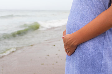 Pregnant woman at the seaside