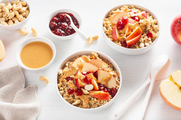 apple peanut butter quinoa bowl with jam and cashew for healthy breakfast