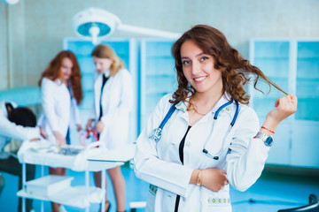 Portrait of a doctor intern. Medical students profession staff. multinational people - doctor, nurse and surgeon. A group of graduates of a medical university in a surgical room.