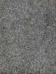 black small stone on the ground shooting from the top view for background.
