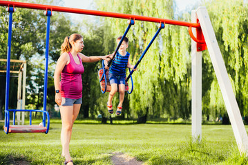 little girl on a swing