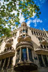 Fototapeta na wymiar BARCELONA, CATALONIA - APRIL 2019: Passeig de Gracia in Barcelona, Catalonia. It one of major avenue in city. Located in the Eixample district. Shopping and business areas