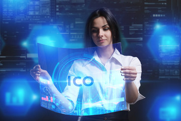 The concept of business, technology, the Internet and the network. A young entrepreneur working on a virtual screen of the future and sees the inscription: ICO