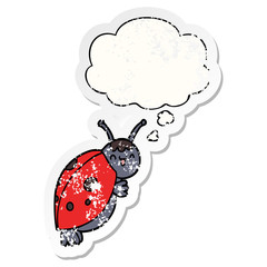 cute cartoon ladybug and thought bubble as a distressed worn sticker