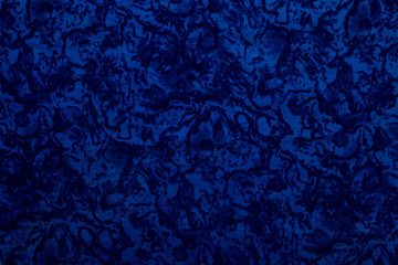 Blue colored fabric texture along with some designs of black color.Used as background or abstract background or texture.