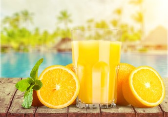 Orange juice and slices of orange on desk © BillionPhotos.com