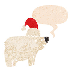 cartoon bear wearing christmas hat and speech bubble in retro textured style