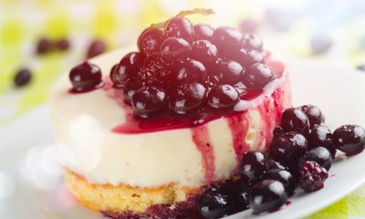 Delicious sweet cheesecake with blueberries on white plate
