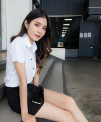 Portrait of thai adult student university uniform beautiful girl relax and smile