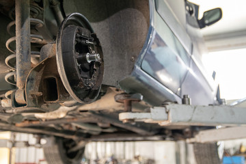 Fototapeta premium Car repair, rear drum brake repair