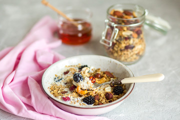 Granola with yogurt, honey and berries. Breakfast with berries and nuts. The correct breakfast....