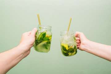 Mojito cocktail in a glass beaker. People keep in their crawfish a summer cold drink with lime,...