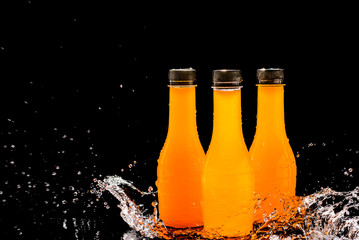 Orange juice, orange juice bottle with splash water Refreshing ideas to solve thirst