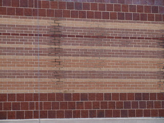 A Brick Design Used In Several Walls of an Abandoned Building with Texture of Stains From An Old Downspout 