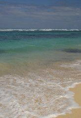 View from a beautiful white sandy beach on the ocean horizon and blue sky	